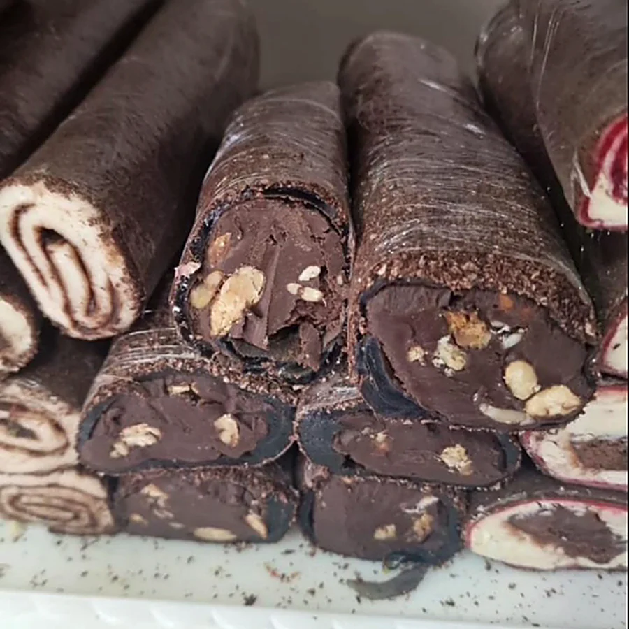 Sliced chocolate rolls with nuts