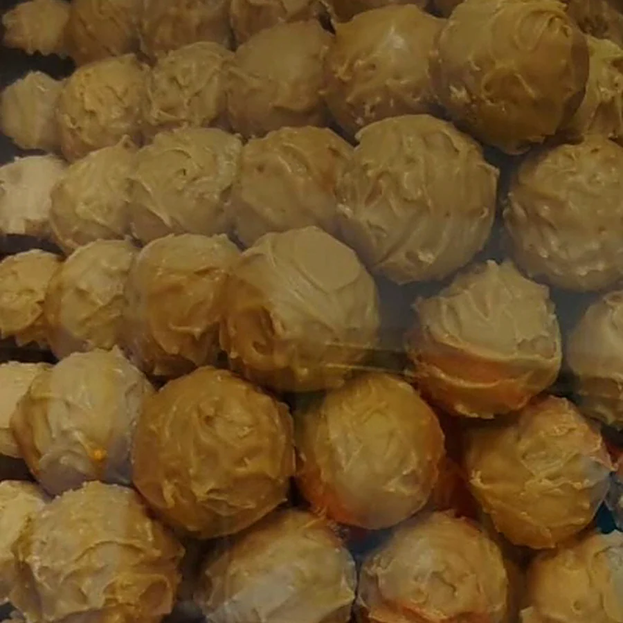 Truffles in golden coating on the display