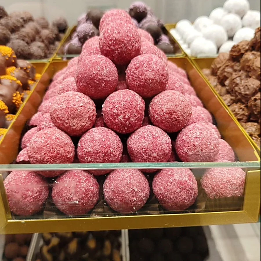 Pyramid of truffles in pink coconut coating